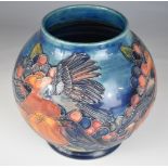 Moorcroft pedestal baluster vase decorated in the the Finches pattern, signed WM to base, height