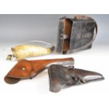 Two military leather revolver or pistol holsters including one to suit a Luger P08 or similar pistol