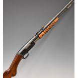 Browning .22 pump-action rifle with semi-pistol grip, adjustable sights and 21.5 inch barrel,