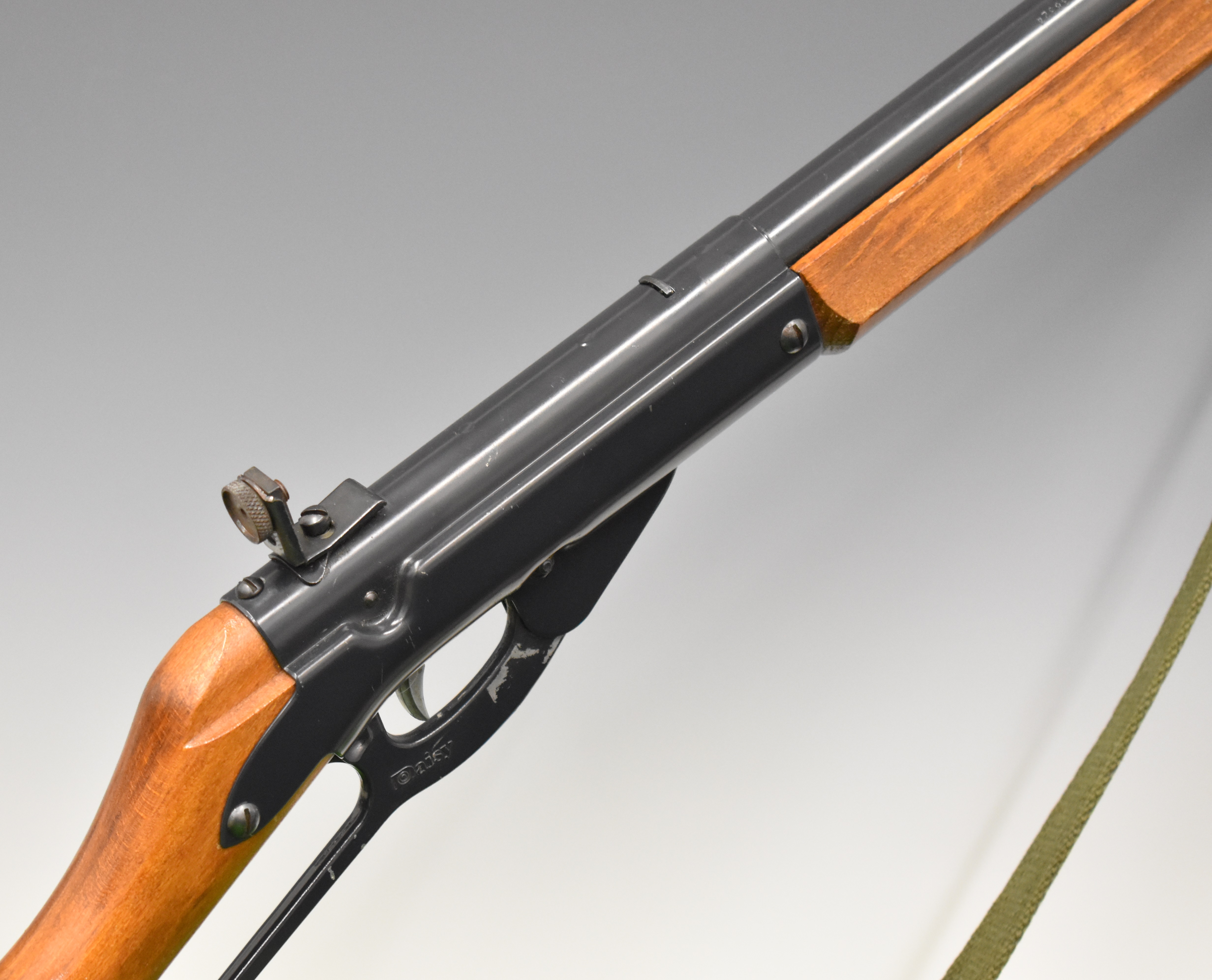 Daisy Model 99 Winchester style underlever-action air rifle with wooden grip and forend, canvas