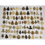 Collection of approximately 80 British Corps cap badges including Army Education Corps, REME,