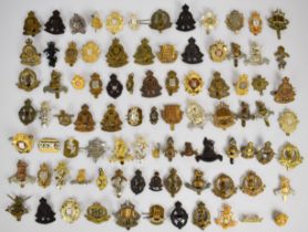 Collection of approximately 80 British Corps cap badges including Army Education Corps, REME,