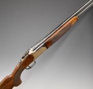 Lanber 12 bore over and under shotgun with engraved locks, underside, trigger guard and thumb lever,