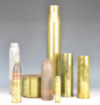 Two shell cases with projectiles, one dated 1942 the other 1904, together with three additional