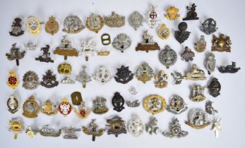 Collection of approximately 60 British Army badges including Royal Sussex Regiment,
