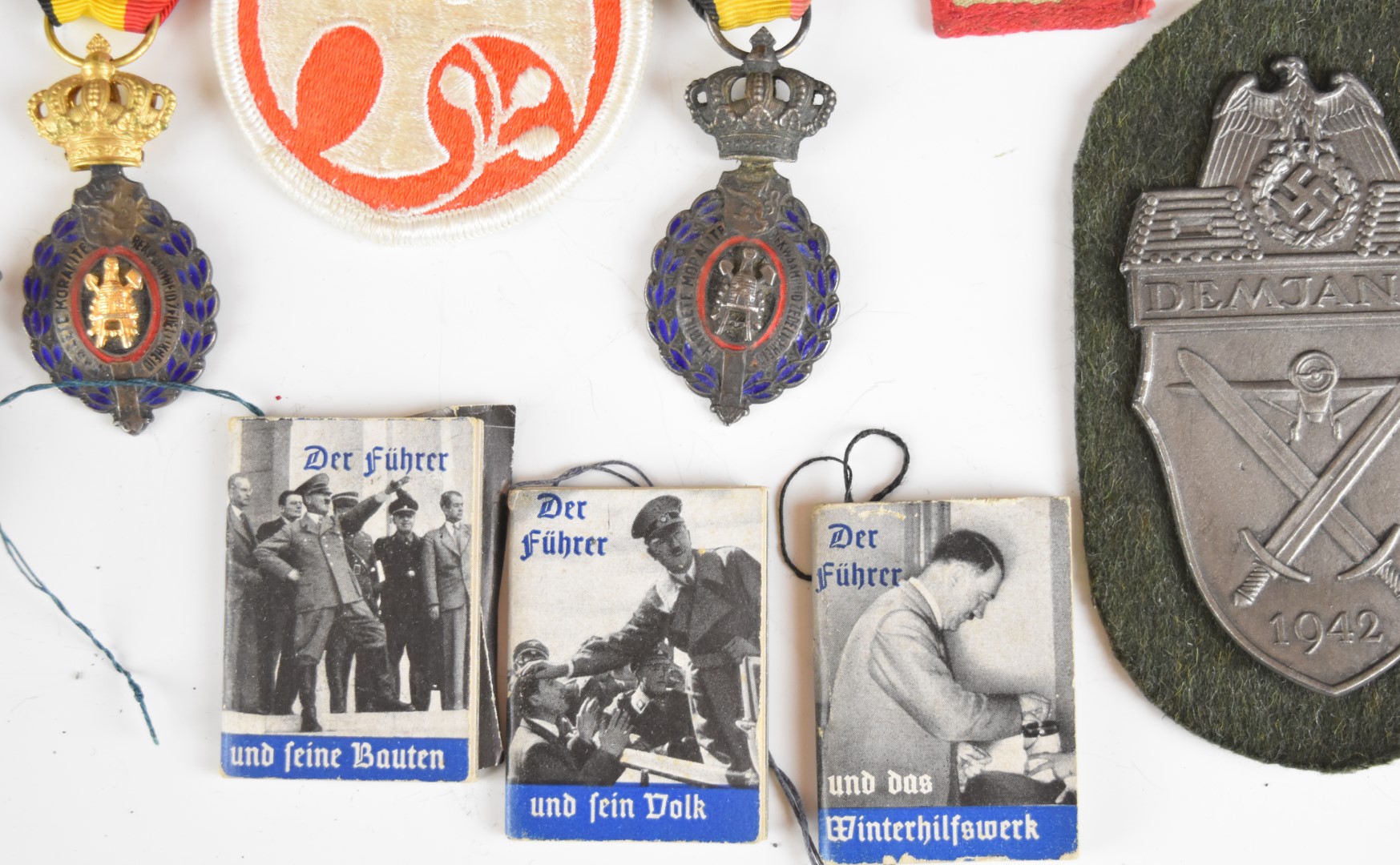 Mainly reproduction German WW2 Nazi insignia, booklets etc - Image 3 of 16