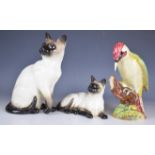 Beswick woodpecker and Siamese cat figures, tallest 27cm
