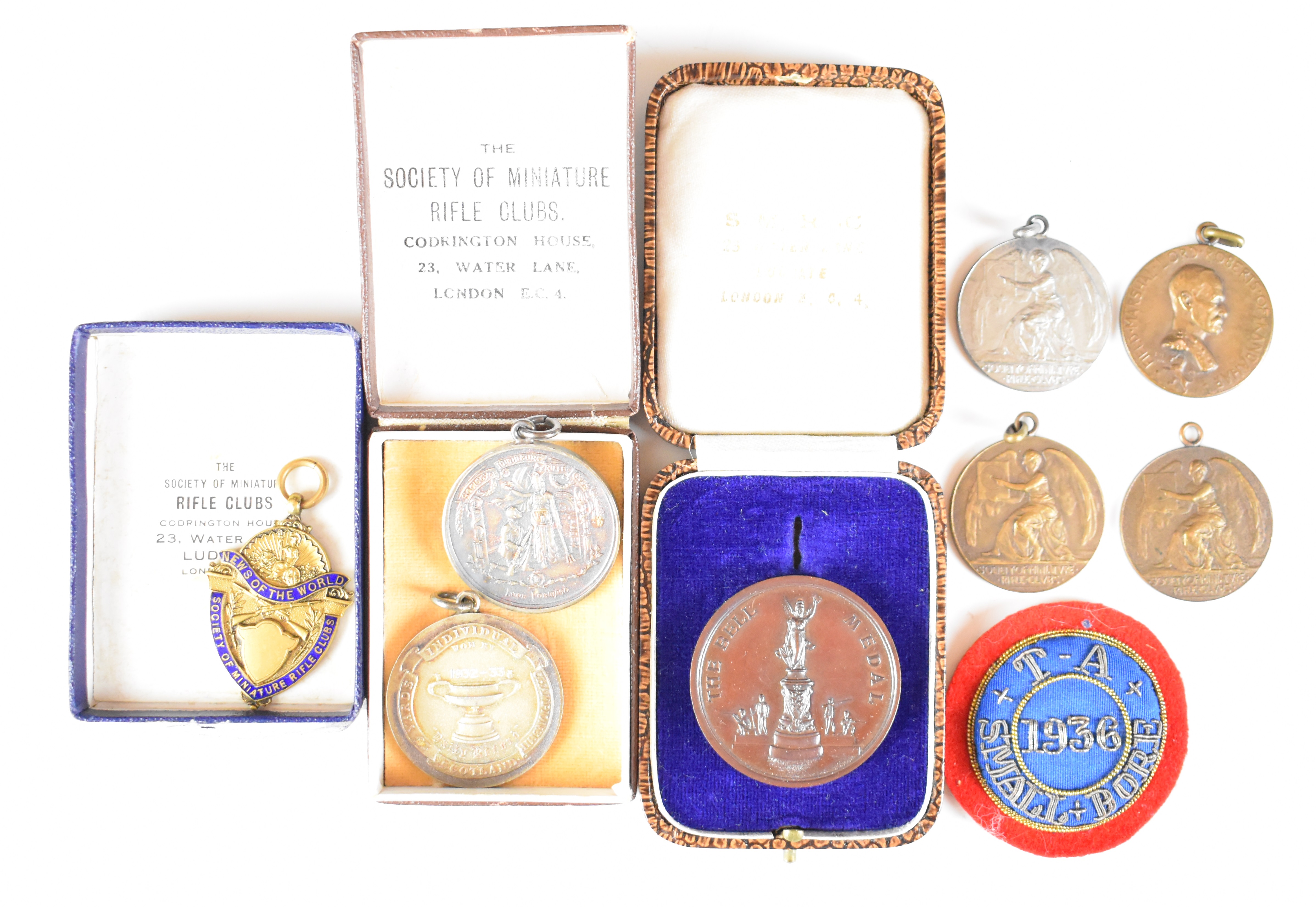 Eight Society of Miniature Rifle Clubs medals comprising two hallmarked silver examples (one