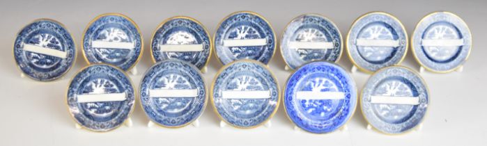 Twelve 19thC blue and white transfer printed circular place name plaques in the form of miniature