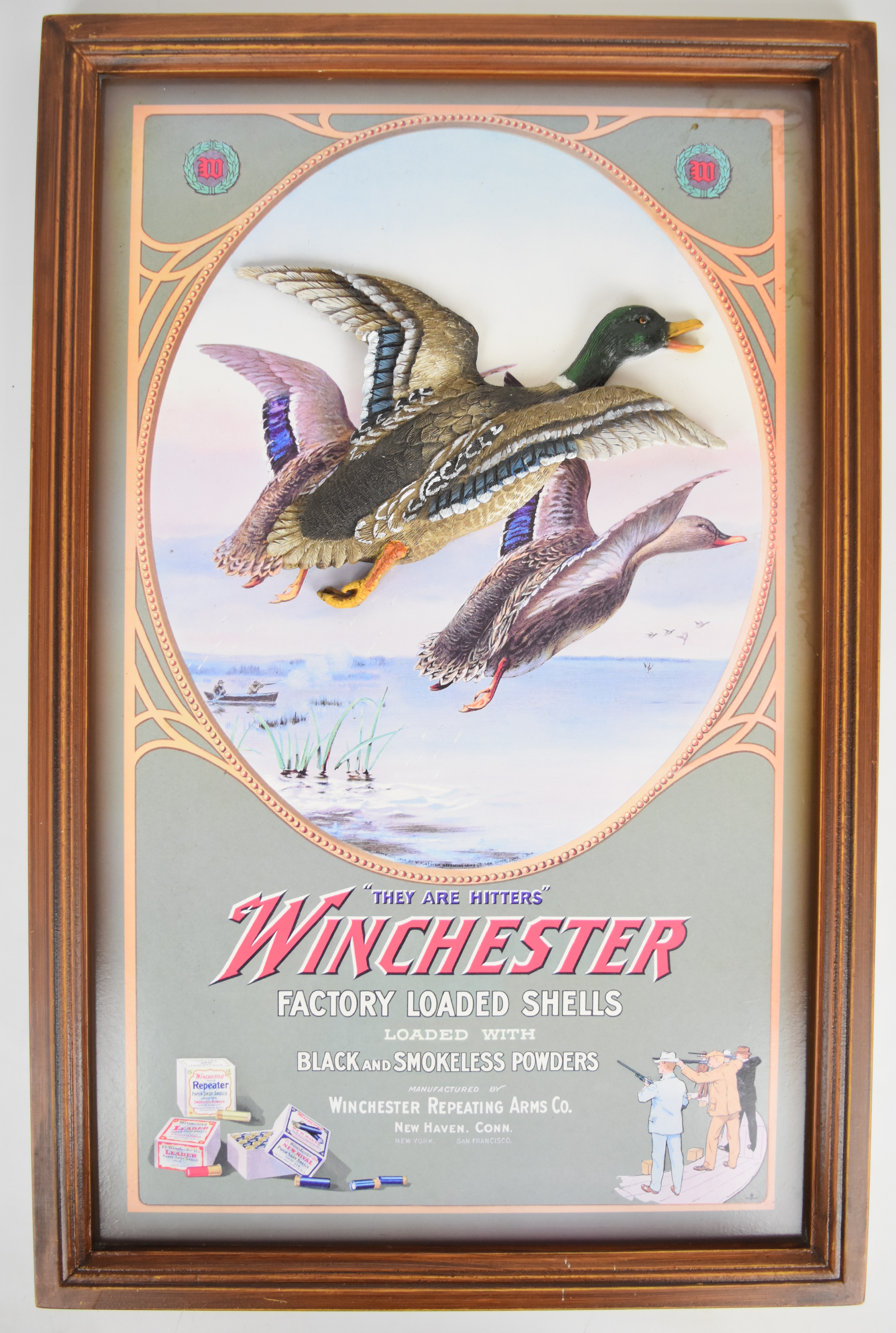 Winchester shop advertising or display sign with relief moulded plaque of a duck in fights and