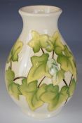 Moorcroft pedestal vase with ivy leaf decoration, signed WM to base, height 20cm