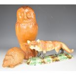 Salt glazed stoneware figures of an owl and a hedgehog and a figure of a fox with spongeware style