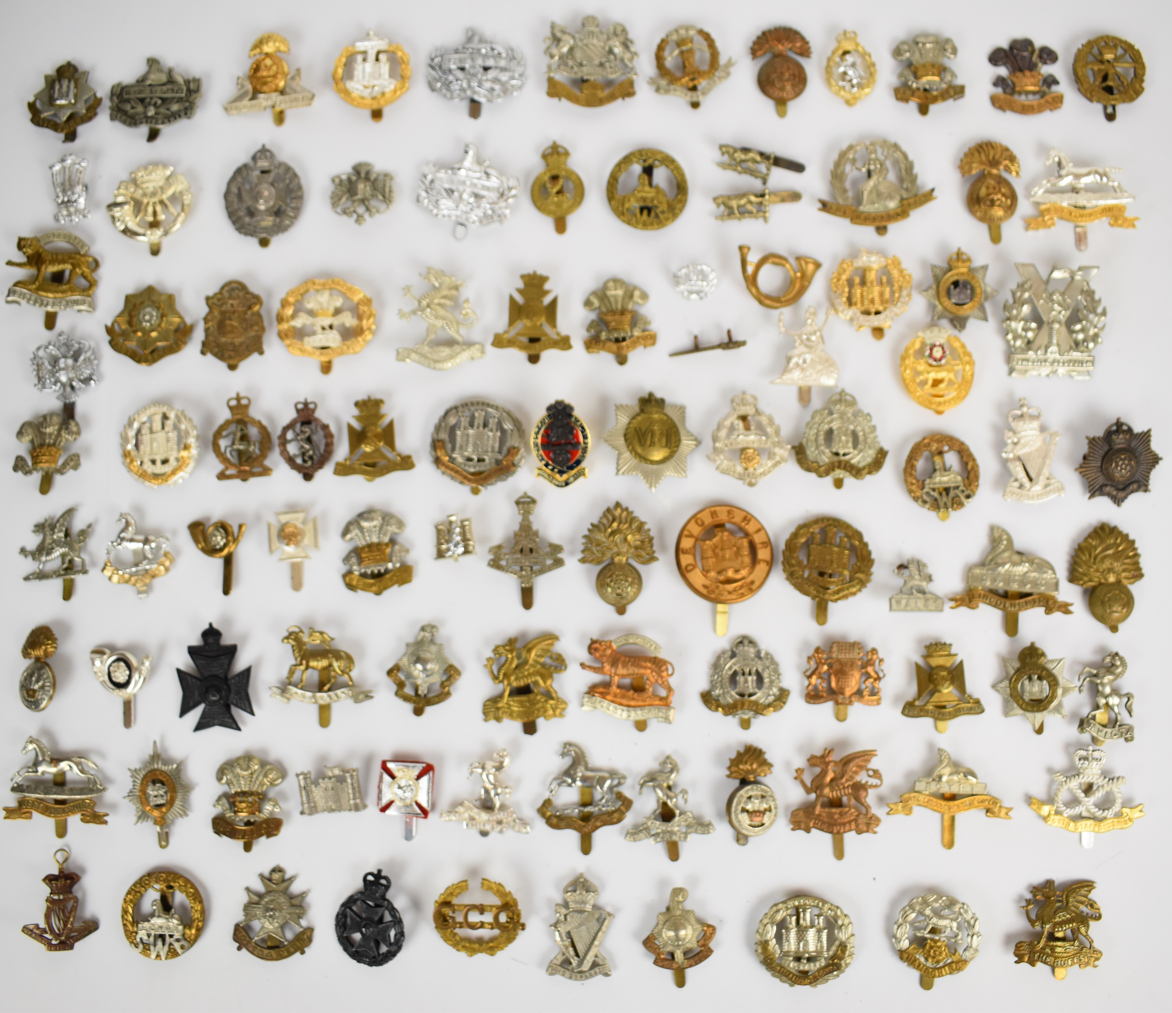 Large collection of approximately 100 British Army cap badges including Manchester 5th Volunteer
