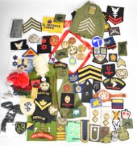 Large collection of approximately 100 military insignia including Army, Royal Navy and Royal Air