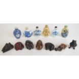 Collection of Chinese and Japanese snuff bottles, netsukes and amber or similar Buddha figure,