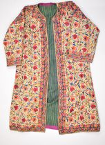 19th / 20thC Indian embroidered coat or coat dress, with a note stating the coat was gifted in the