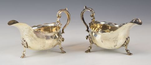 Pair of Goldsmiths Company Ltd Victorian hallmarked silver sauce boats with scroll handles, raised