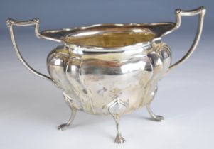 Walker & Hall George V hallmarked silver twin handled silver sugar bowl raised on four feet,