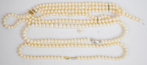 A single strand of cultured pearls with 14k gold clasp, three strand cultured pearl necklace with