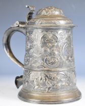 Large two pint hallmarked silver lidded tankard with scroll handle terminating in a heart, the