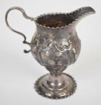 Georgian hallmarked silver cream jug with embossed decoration, London, date letter indistinct, maker