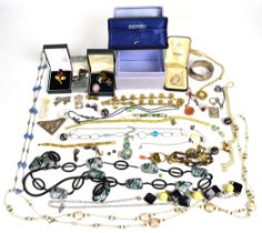 A collection of jewellery including silver rings, silver bangle, butterfly wing pendant, etc