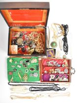 A collection of Victorian and Art Deco costume jewellery including paste brooches, Art Deco beads,