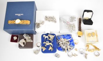 A collection of jewellery including silver charm bracelet, brooches including marcasite, Art Deco