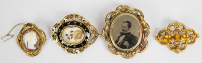 Victorian mourning brooch set with black enamel and hair and three other Victorian brooches