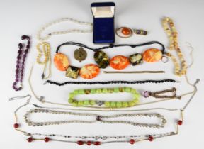 A collection of costume jewellery including agate necklaces, Art Deco beads, silver ring, rolled