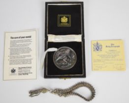 The Pompeii silver medal in original box and a silver fob chain