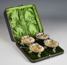 Victorian cased set of four hallmarked silver salts, formed as shells on dolphin feet, Birmingham