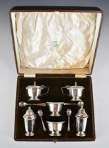 Walker & Hall cased hallmarked silver cruet set with blue glass liners, comprising two each of salt,