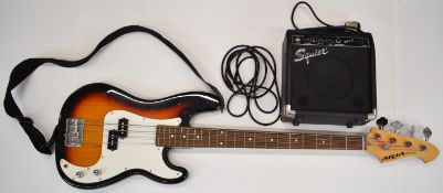 Aria STB Series bass guitar together with a Squire SP10 practice amp