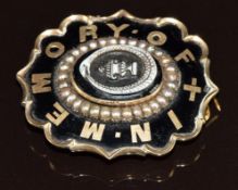 Victorian mourning brooch set with black enamel with gold writing reading 'In memory of', split