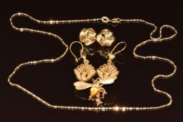 A 14k gold brooch in the form of a bee set with a citrine cabochon (3.8g), a 14k gold chain/