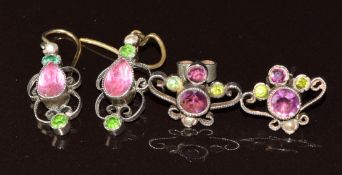 A pair of silver Suffragette earrings set with a seed pearl and purple and green paste, and a