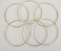 Six silver bangles with textured finishes, 39g