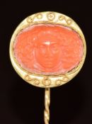 Victorian yellow metal stick pin set with a coral cameo of a man, 5.3g, 7cm