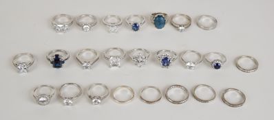 Twenty four silver rings set with cubic zirconia, 96g