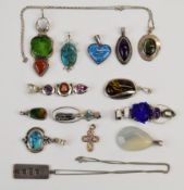 Fourteen silver pendants including turquoise, amethyst, pressed amber, etc