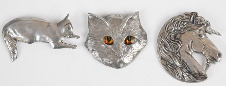 Three David Kemp brooches, two cats and one unicorn