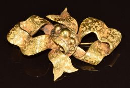 Victorian yellow metal bow brooch with scrolling decoration, 19.1g, 7 x 5cm