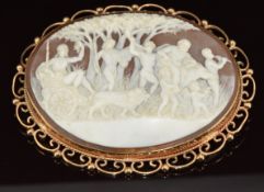 A 9ct gold brooch set with a large cameo depicting a scene, 25g, 7 x 5cm