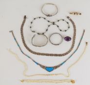 A collection of jewellery including two silver necklaces, silver bangle, 9ct gold brooch set with
