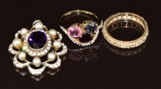 A 9ct gold eternity ring (2.9g, size N), silver ring and silver pendant set with paste