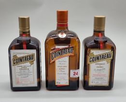 Three bottles of Cointreau, comprising: a 1 litre and two 70cl examples. (3)