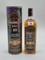 A 1 litre bottle of Bushmills 10 Years Old Irish Whiskey, in card tube.