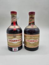 Two bottles of Drambuie, comprising: a 23 3/4 fl.oz. example; and a 70cl example. (2)