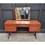 A mid-century G-Plan mirror back dressing table, 137cm wide, (damage to mirror support); together